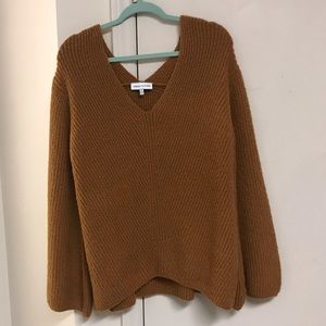 mustard sweater with bell sleeves